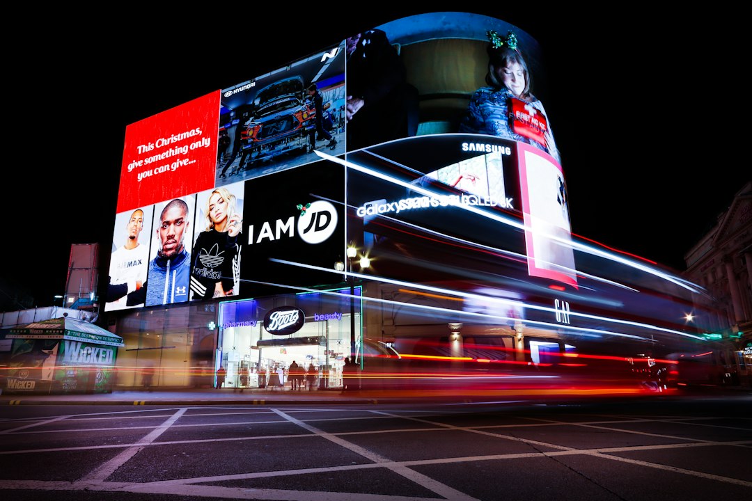 City advertising screens and outdoor media used as placeholder imagery. Photo by Robert Likovszki on Unsplash.